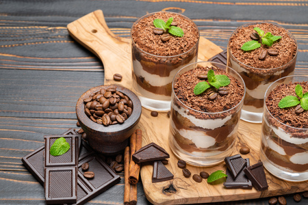 Classic tiramisu dessert in a glass on wooden backgroundの写真素材
