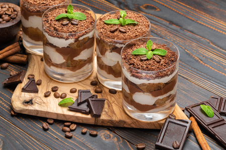 Classic tiramisu dessert in a glass on wooden backgroundの写真素材