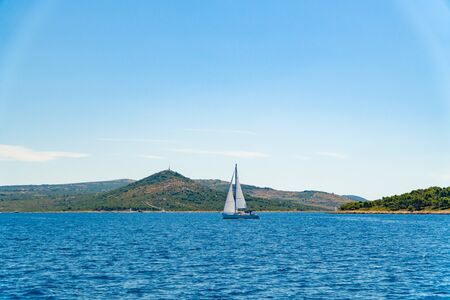 Lonely Yacht sailing on opened sea, Croatiaの写真素材