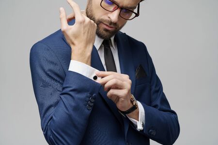 studio shot stylish businessman wearing suit and watches