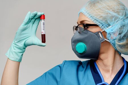 medical doctor nurse woman wearing protective mask and gloves - holding negative coronavirus...