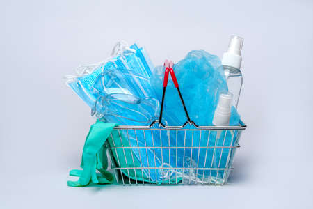 shobbing basket cart full of medical facilities - disposable medical face masks, pair of latex...