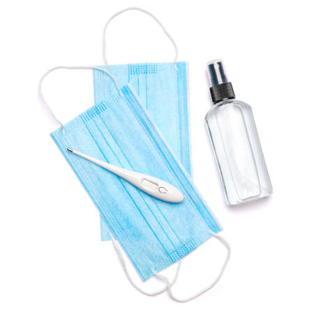 bottle of lotion, sanitizer or liquid soap, thermometer and medical protective mask isolated on...