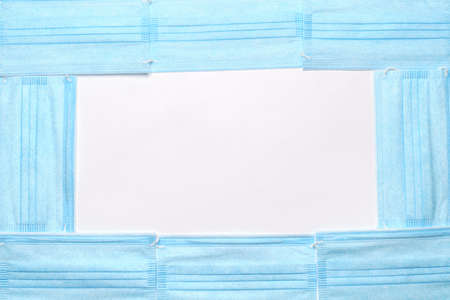 coronavirus COVID-19 pandemic concept - frame of antiviral surgical protective medical mask for...