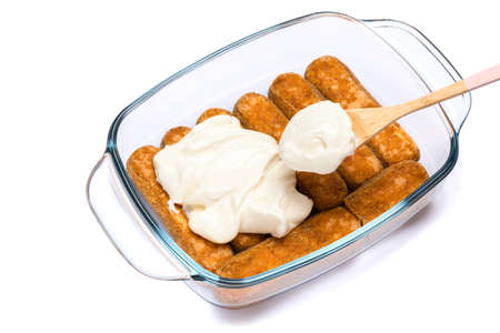 tiramisu dessert cooking - Traditional Italian Savoiardi ladyfingers Biscuits and cream in glass...