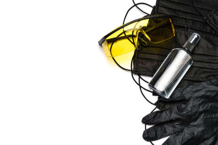 Safety equipment to fight to Coronavirus COVID-19 virus outbreak - Safety mask, hand sanitizer, latex gloves and protective glasses or gogglesの写真素材
