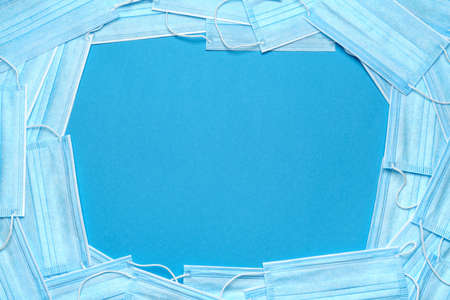 coronavirus COVID-19 pandemic concept - background made of antiviral surgical protective medical masksの写真素材