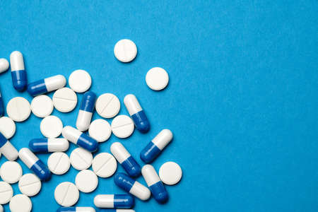 group of pills or capsules on blue backgroundの写真素材