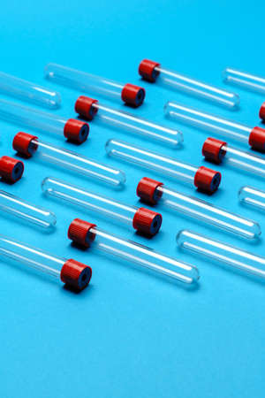top view of medicine test tubes for blood samples over blue background
