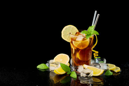 Glass of Fresh Long Island Ice Tea Cocktail - studio shot on black backgroundの写真素材