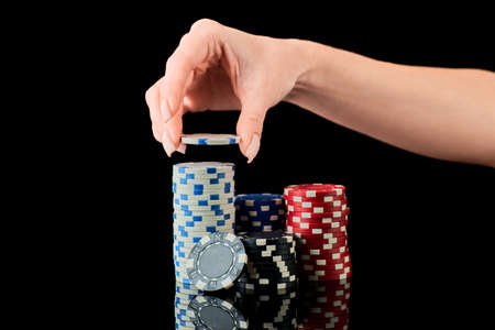 Stack of Casino gambling chips isolated on black