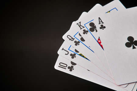 Straight flush - playing cards on dark background