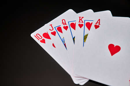 playing cards with flesh royale on dark reflective backgroundの写真素材