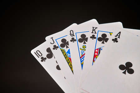 playing cards with flesh royale on dark reflective background