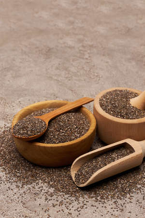 Bowl of organic natural chia seeds close-up on concrete background or tableの写真素材