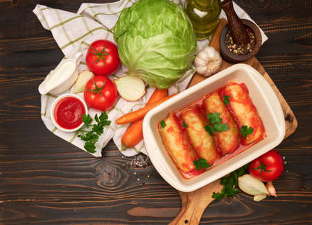 Portion of stuffed cabbage rolls on wooden tableの写真素材