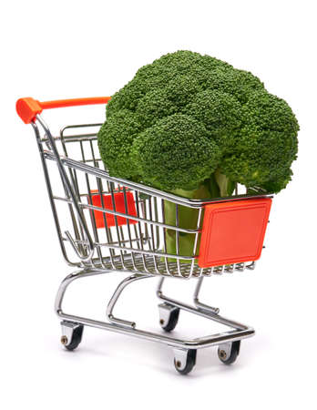 Fresh natural organic broccoli in shopping cart isolated on white backgroundの写真素材