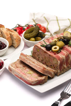 Traditional French terrine covered with bacon isolated on white background
