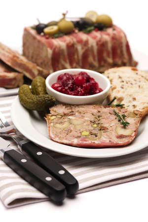 Portion of Traditional French terrine covered with bacon isolated on white background