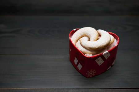 Heart shaped Gift box full of Traditional German or Austrian Vanillekipferl vanilla kipferl cookiesの写真素材