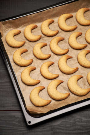 Baking tray with traditional German or Austrian Vanillekipferl vanilla kipferl cookiesの写真素材