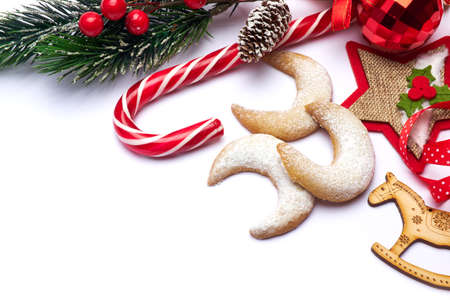 Christmas and New Year symbols and attributes of winter holidays - candy, cookies, pine coneの写真素材