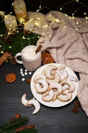 Plate of Traditional German or Austrian Vanillekipferl vanilla kipferl cookies and decorationsの写真素材