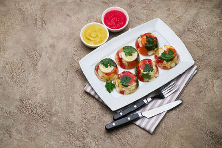 Portion of delicious chicken aspic on a plate isolated on concrete table