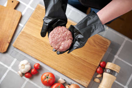 Making Billets for burgers from fresh minced meat on domestic kitchenの写真素材