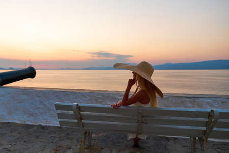 Beautiful girl tourist walking in the streets of Hydra, Greeceの写真素材