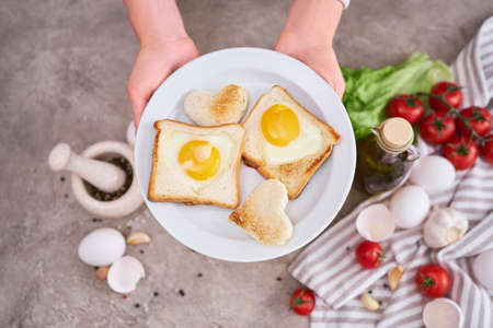 Fried Egg on Toast Bread on concrete table for Breakfastの素材 [FY310189504169]