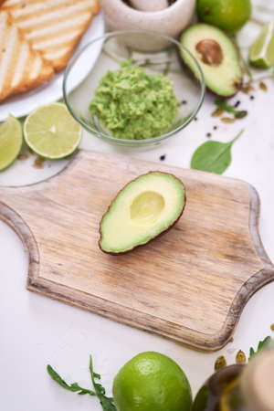 Toasts preparation - Mashed avocados in a glass bowl