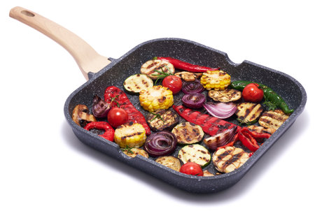 Grilled vegetables on grill pan isolated on white backgroundの写真素材