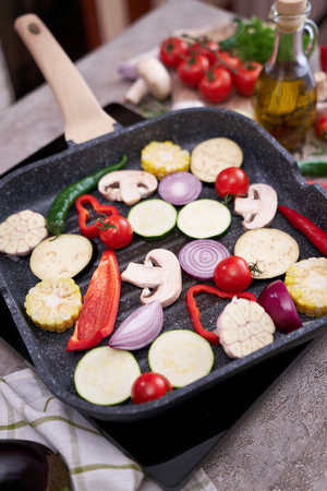 Grilled vegetables on grill pan at domestic kitchenの写真素材