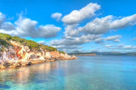 a view from dragunara bay, sardinia, in a sunny cloudy day of springの写真素材
