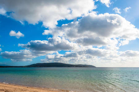 the mugoni beach in sardinia in a sunny and cloudy day of springの写真素材