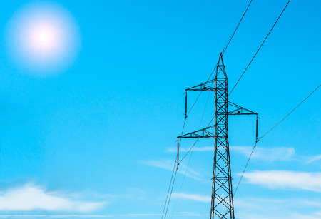 electricity pylon isolated on a blue sunny sky