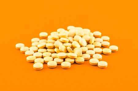 Closeup of various pills of supplement on colored backgroundの写真素材