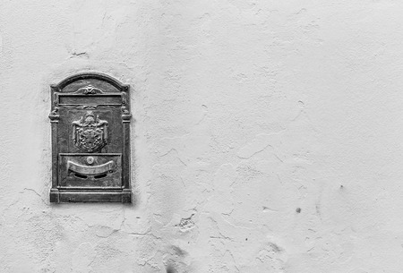 Old mailbox with ancient logo and copy spaceの写真素材