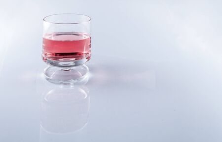 Isolated rosè wine in stemmed glasses on white background with copy spaceの写真素材
