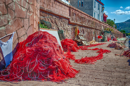 Closeup of fishing net in a harbor in a sunny morning of summer in hdr - Bosa - Sardinia - Italyの写真素材