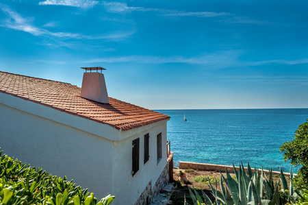 View of little town of Fertilia in a sunny day, village near Alghero, Sardiiaの写真素材
