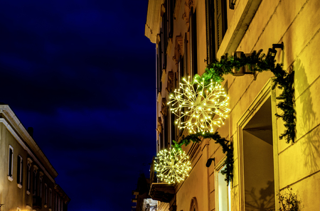 City lights ready for Christmas at night in european small cityの写真素材