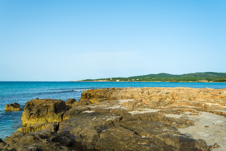 View of sardinian beach of Le Bombarde, near Alghero, in the early morning of summeroの写真素材