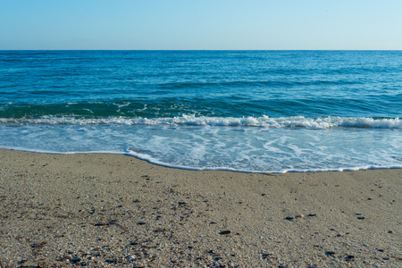Waves on the sand of the desert beach