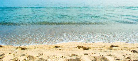 crystal clear water on the beach in summer morningの写真素材
