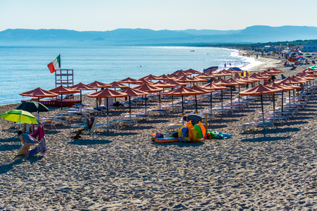 rows of umbrellas on the beachの写真素材