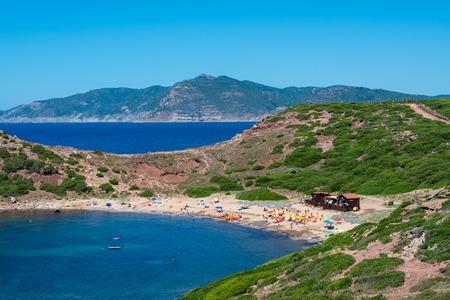 Landscape of the sardinian beach of Porticciolo, with ancient tower on the coast, in summerの写真素材