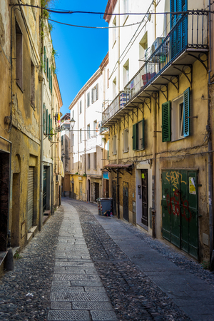 Beautiful deserted alley in a italian old city in a sunny dayの写真素材