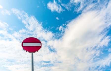 access prohibition road sign under a cloudy spring skyの写真素材